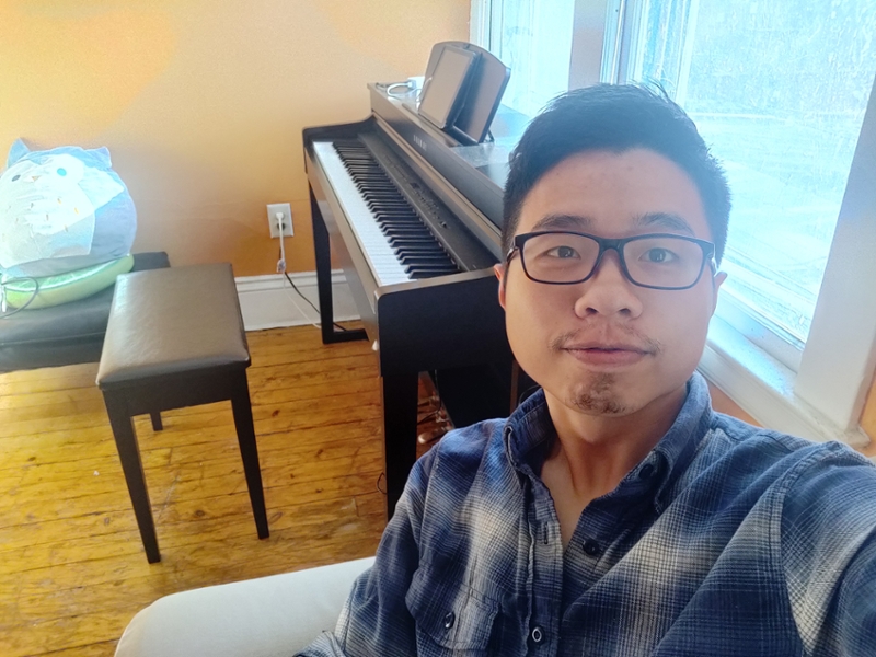 student taking selfie with piano
